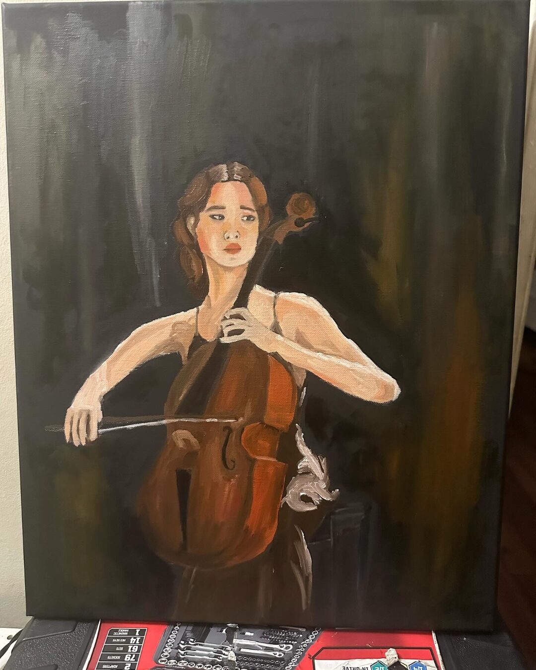 Oil painting of a woman playing cello, by Aniya