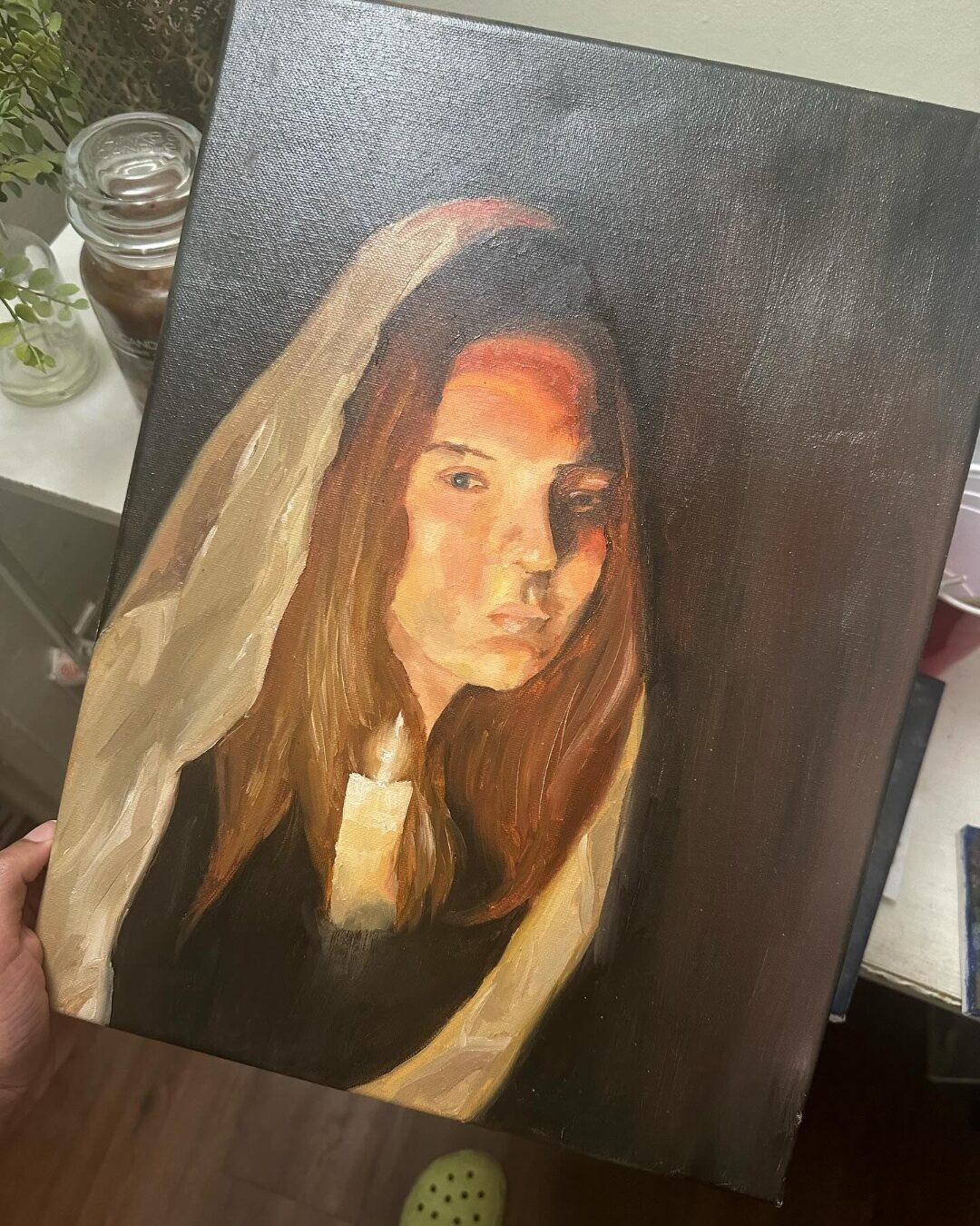 Oil painting of a woman holding a candle by Aniya